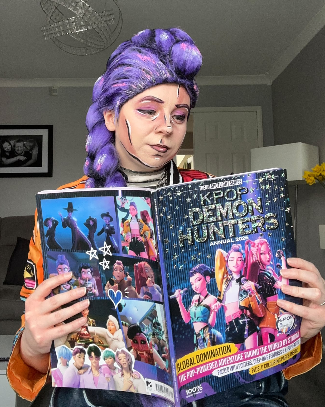 Celshaded Rumi cosplay with Kpop Demon Hunters magazine